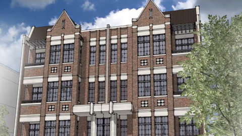 A four-level brick apartments building.
