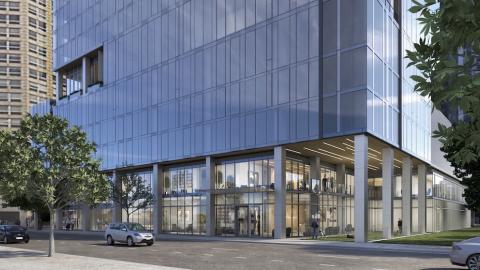 A rendering of a glassy apartment complex with a dog park.